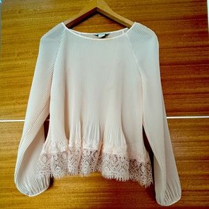 Super elegant sheer embroidered top - perfect over pants or a skirt.